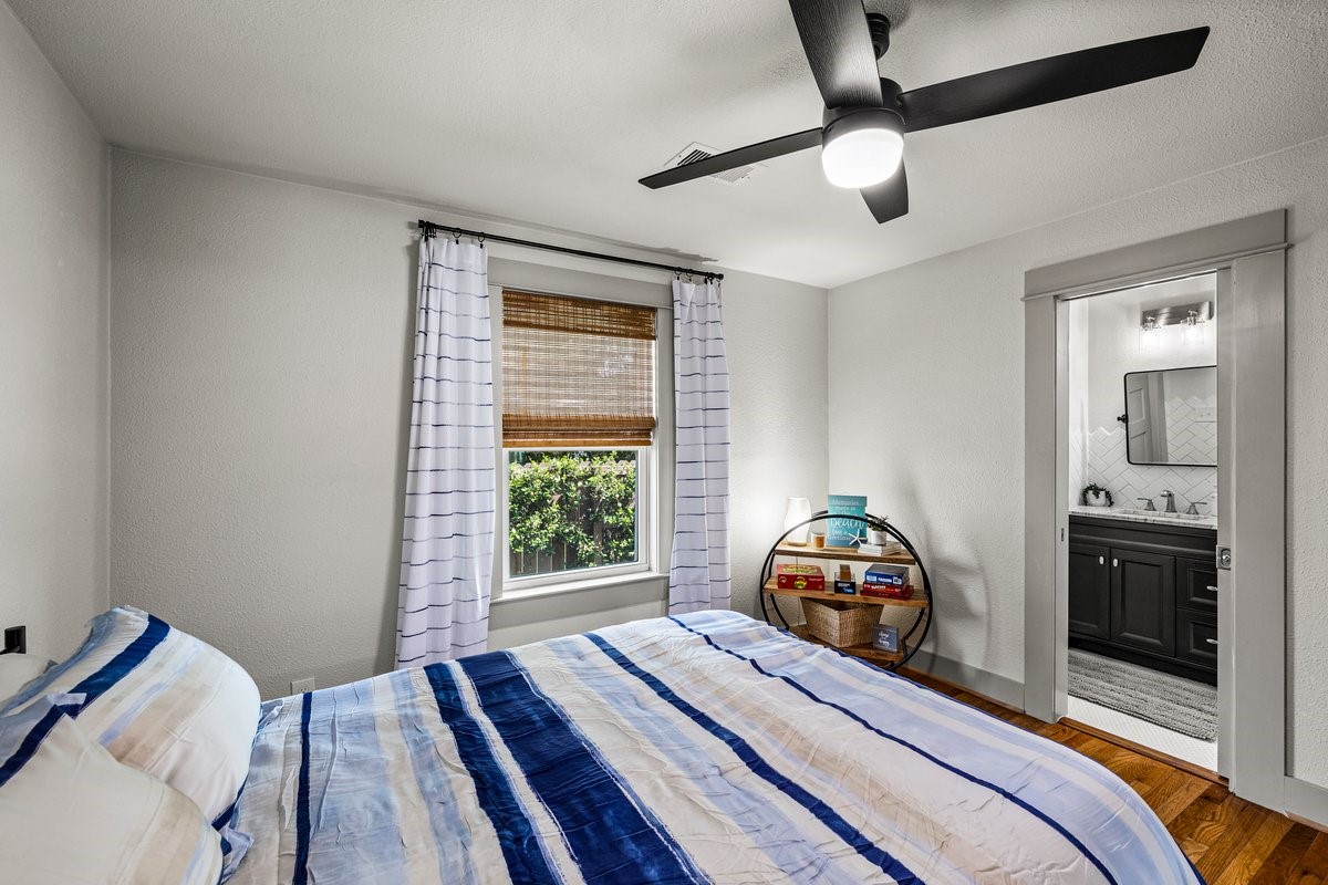 Spacious guest bedroom with private ensuite bathroom.