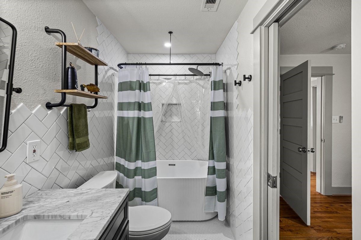Beautifully remodeled primary bathroom #2 in a Galveston home.