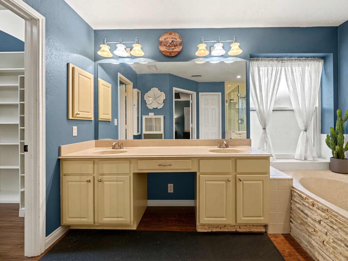 Primary bath with dual vanities. Virtually staged.