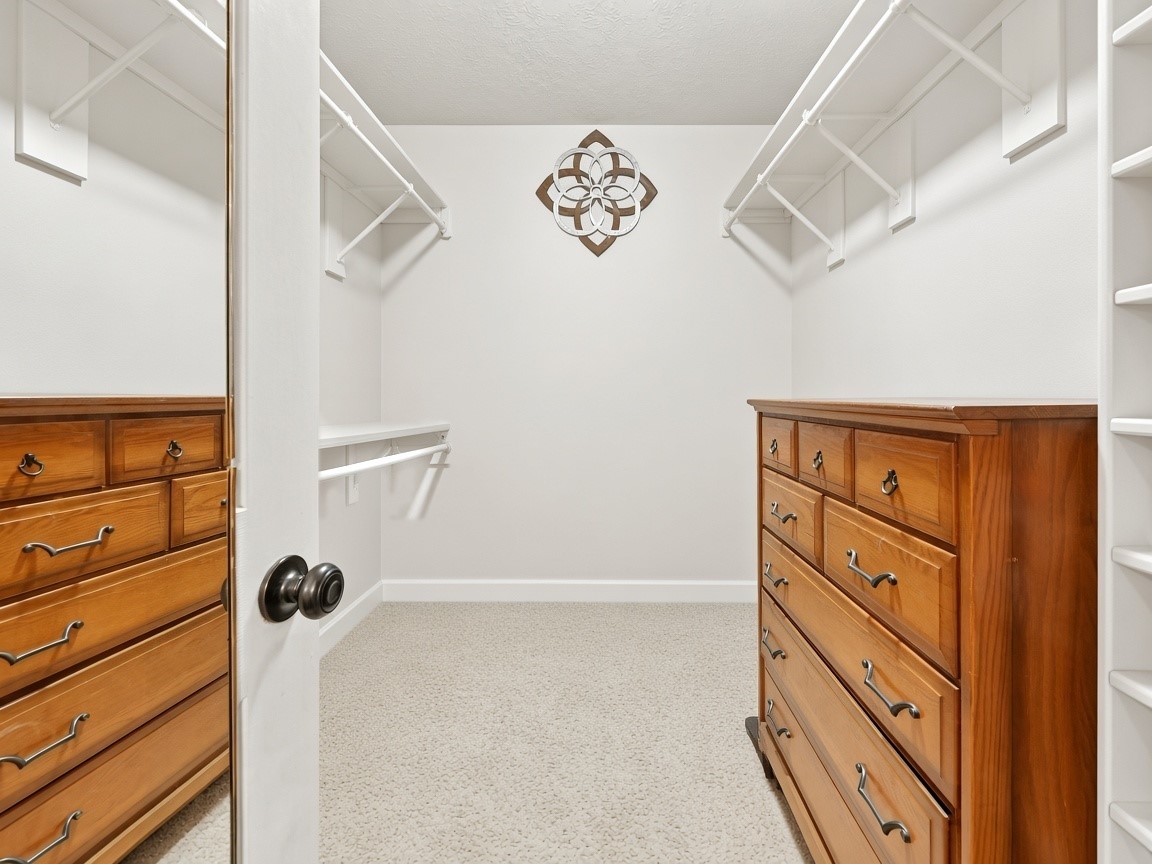 Generous primary walk-in closet. Virtually staged.