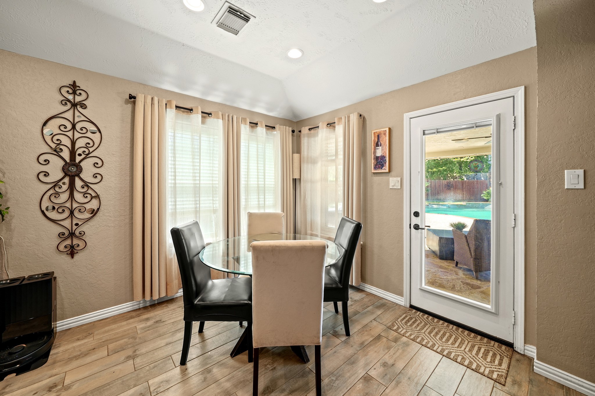 Sunlit breakfast nook with backyard views.