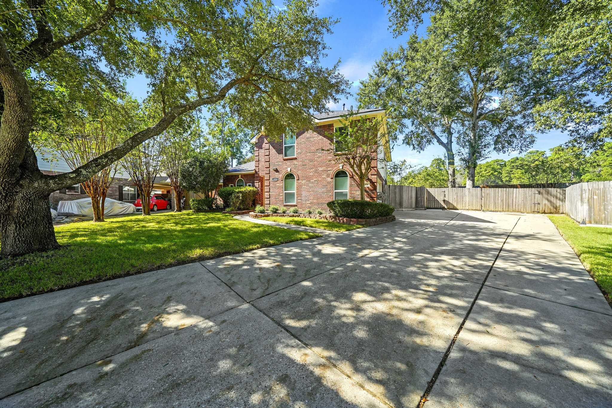 Classic brick facade with mature landscaping.