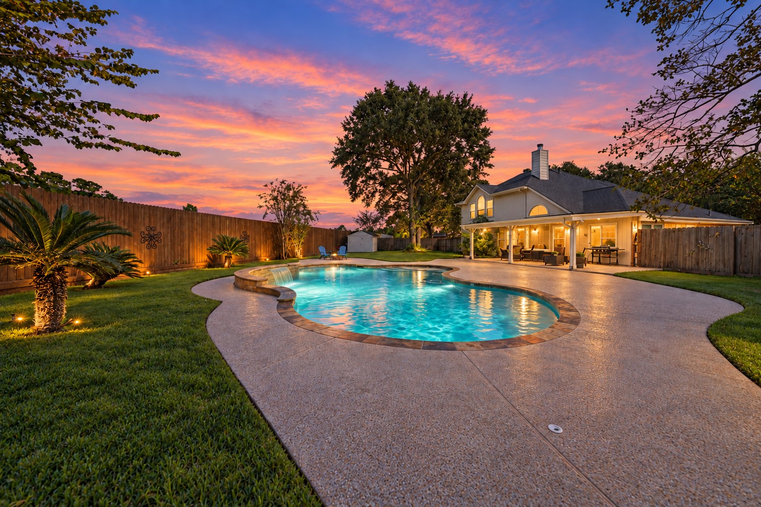 Shimmering backyard pool at golden sunset.