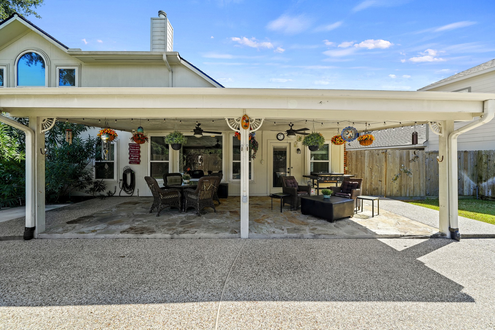 Covered patio with outdoor dining space.