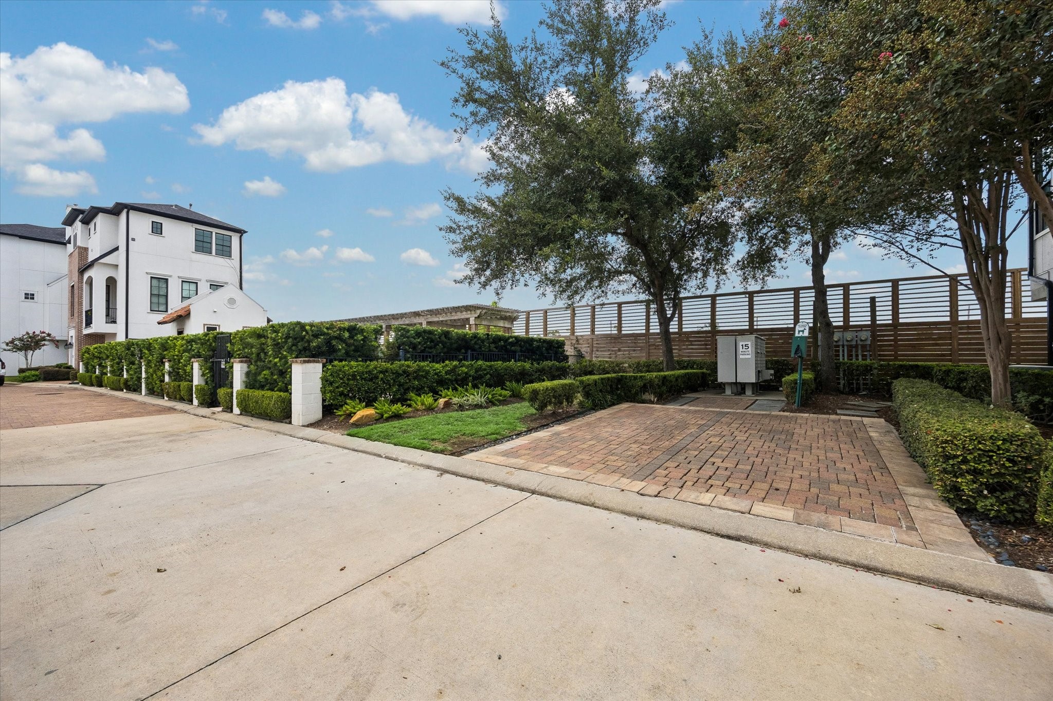 Mature landscaping and tree lined common areas create a peaceful setting within the community, with brick paved spaces thoughtfully integrated throughout the grounds.