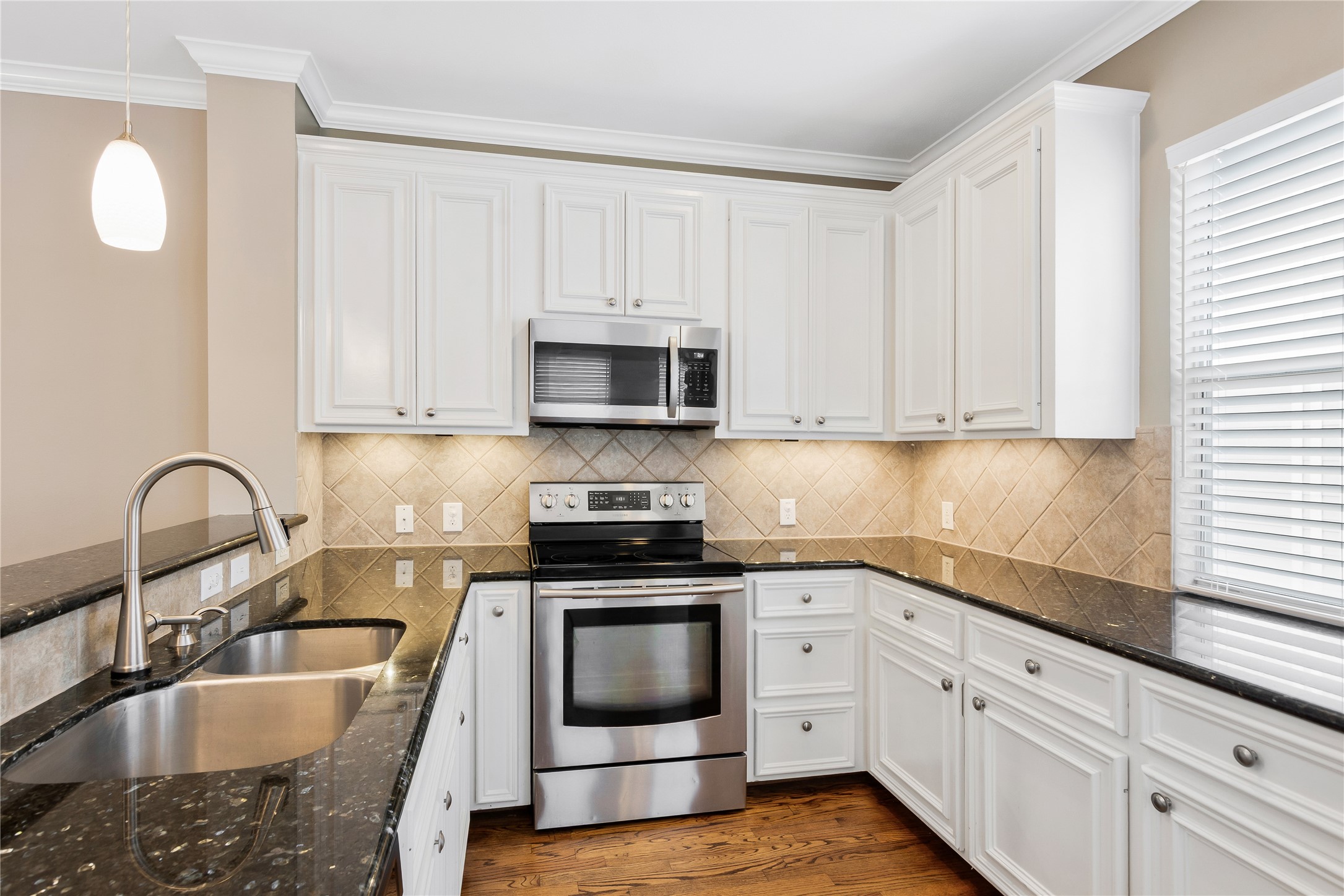 Kitchen with granite countertops, great counter space and stainless-steel appliances Kitchen with granite countertops, great counter space and stainless-steel appliances
