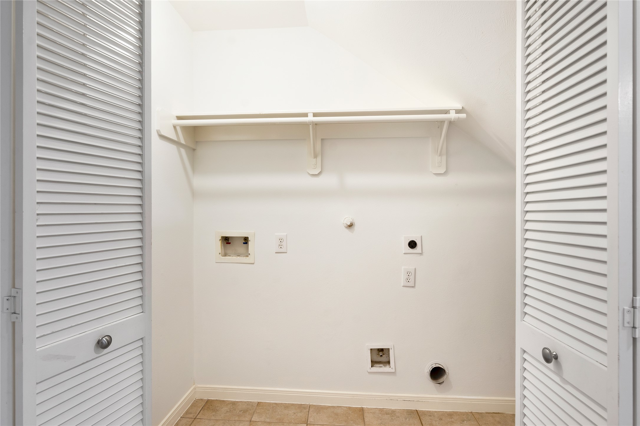 Utility across from bathroom