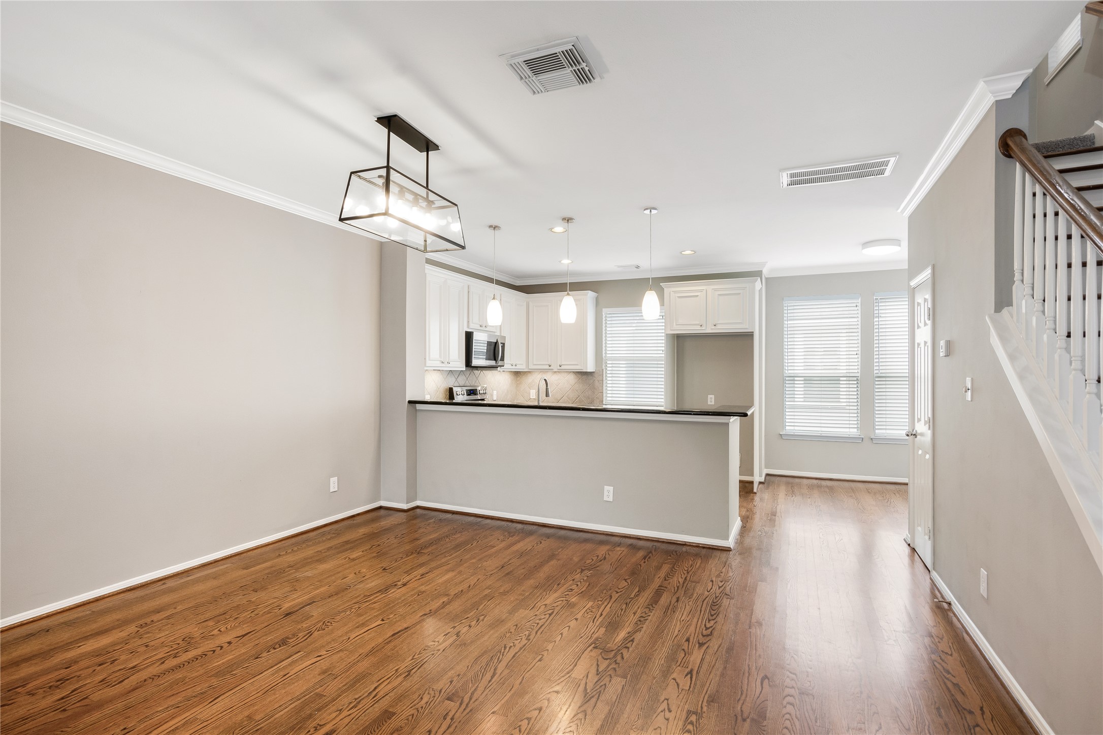 Open and spacious dining area with wood flooring. Open and spacious dining area with wood flooring.