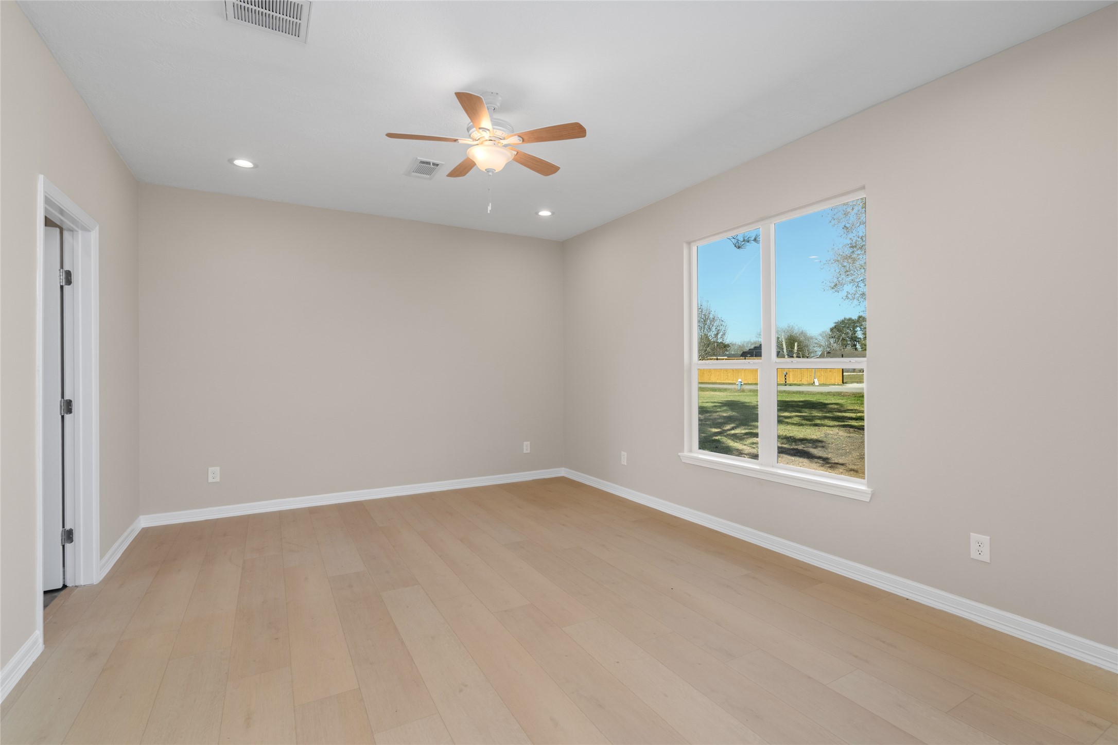 A sun-soaked bedroom with
large windows invites restful
nights and peaceful
mornings, offering both
comfort and tranquility.
