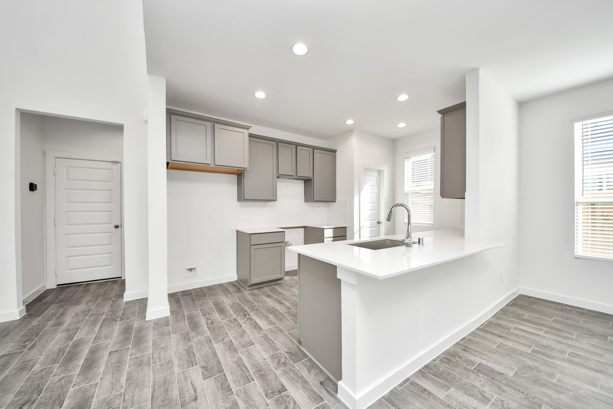 The open concept effortlessly connects the kitchen to the expansive family room, forming a perfect hub for gatherings. This seamless flow creates an inviting space where cooking and socializing come together harmoniously. Sample photo of completed home with similar floor plan. Actual colors and selections may vary.