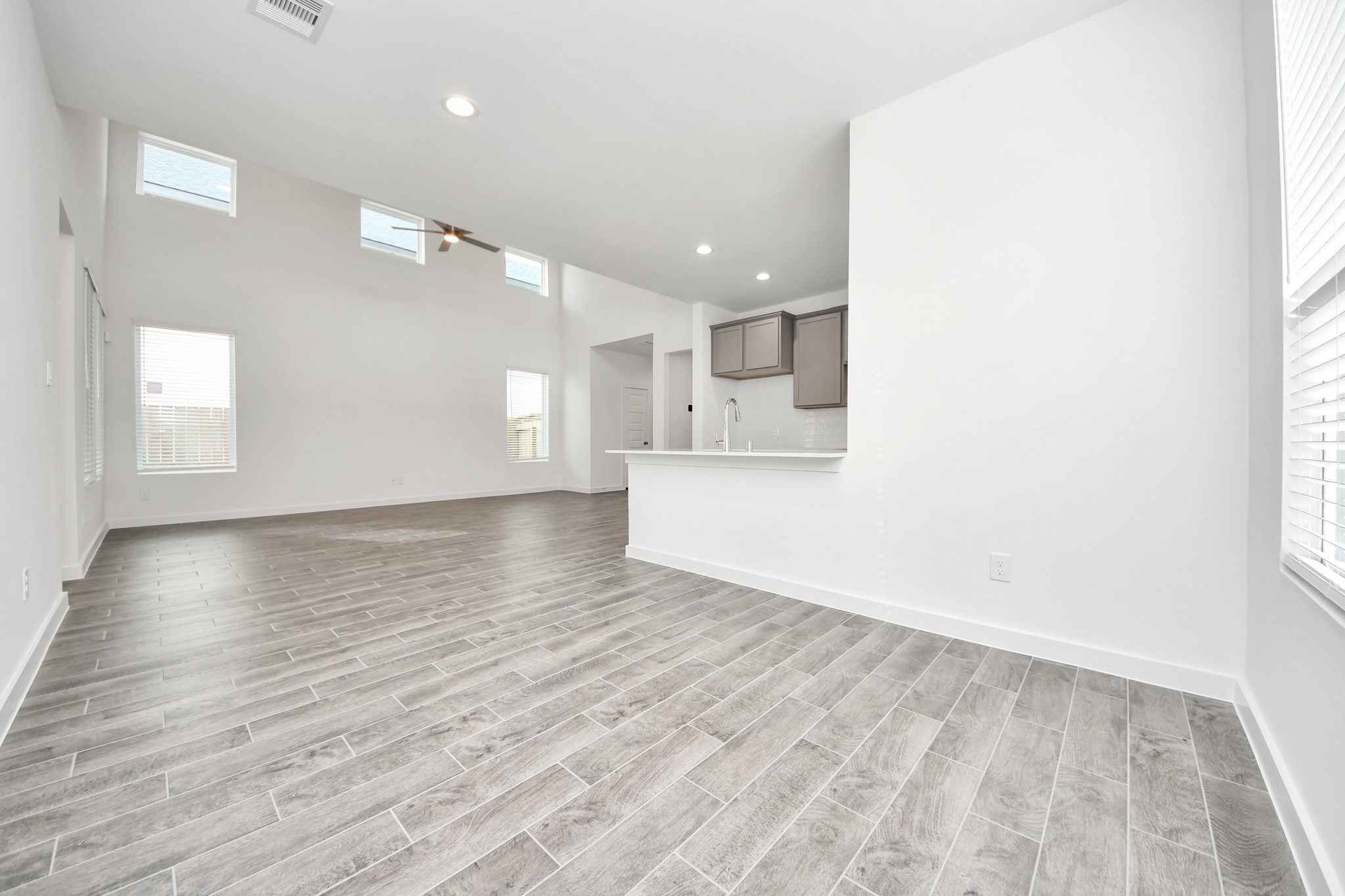 Enjoy breakfast with ease in the connected and cozy breakfast area, seamlessly integrated with the kitchen for utmost convenience. Step through the back door for a breath of fresh air onto the covered patio, extending your living space to the outdoors. Sample photo of completed home with similar floor plan. Actual colors and selections may vary.