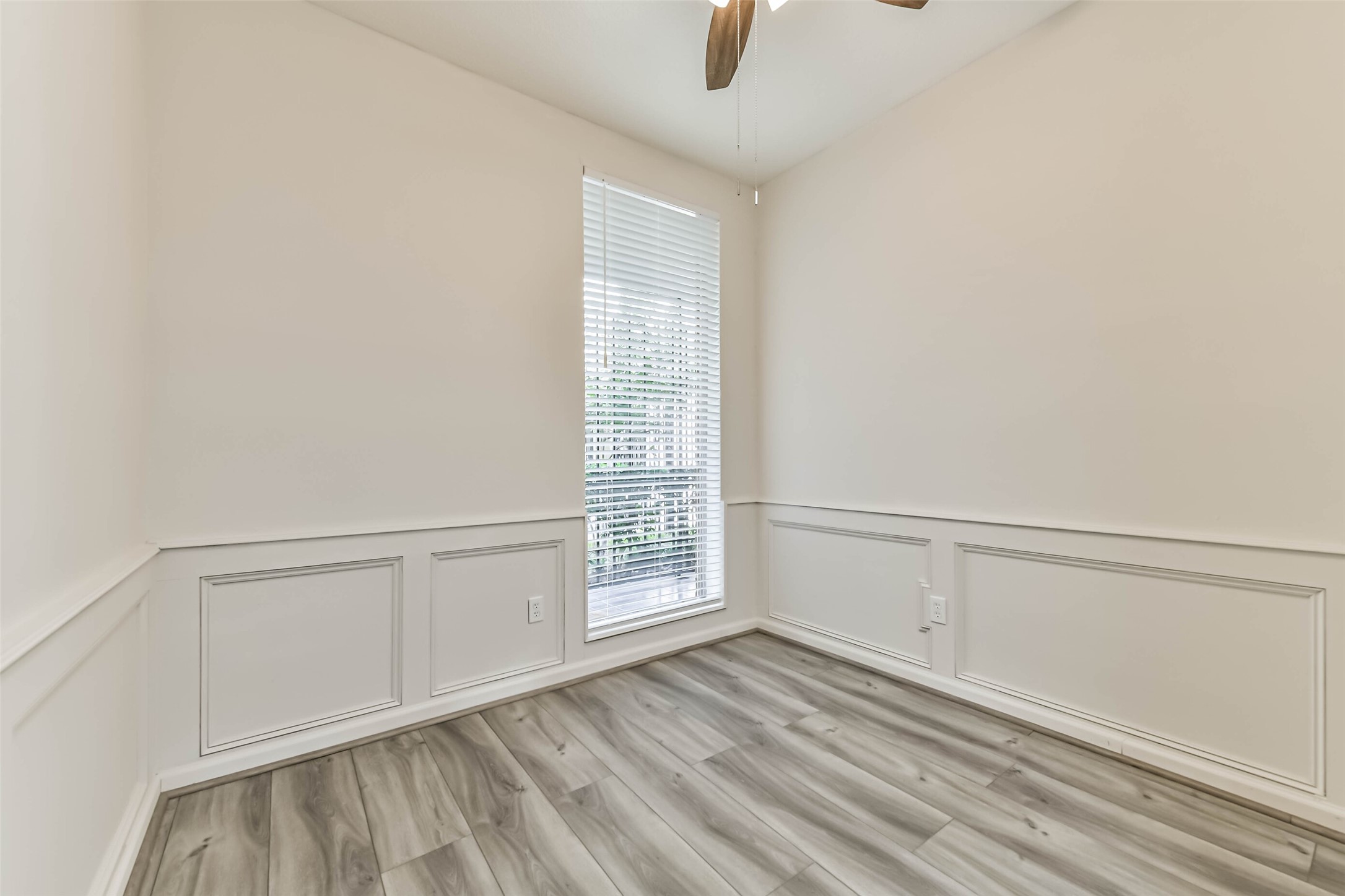 There is a cozy room downstairs that can be used as a study/office with luxury vinyl plank floors.