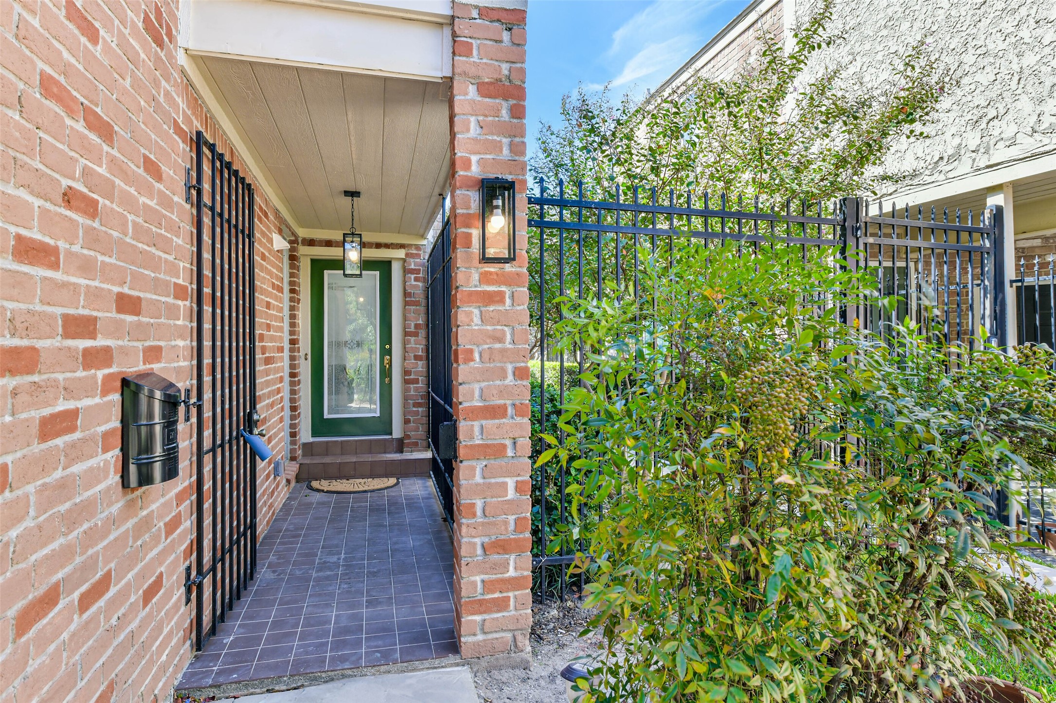 The gated entrance is on the side of the home. The gated entrance is on the side of the home.
