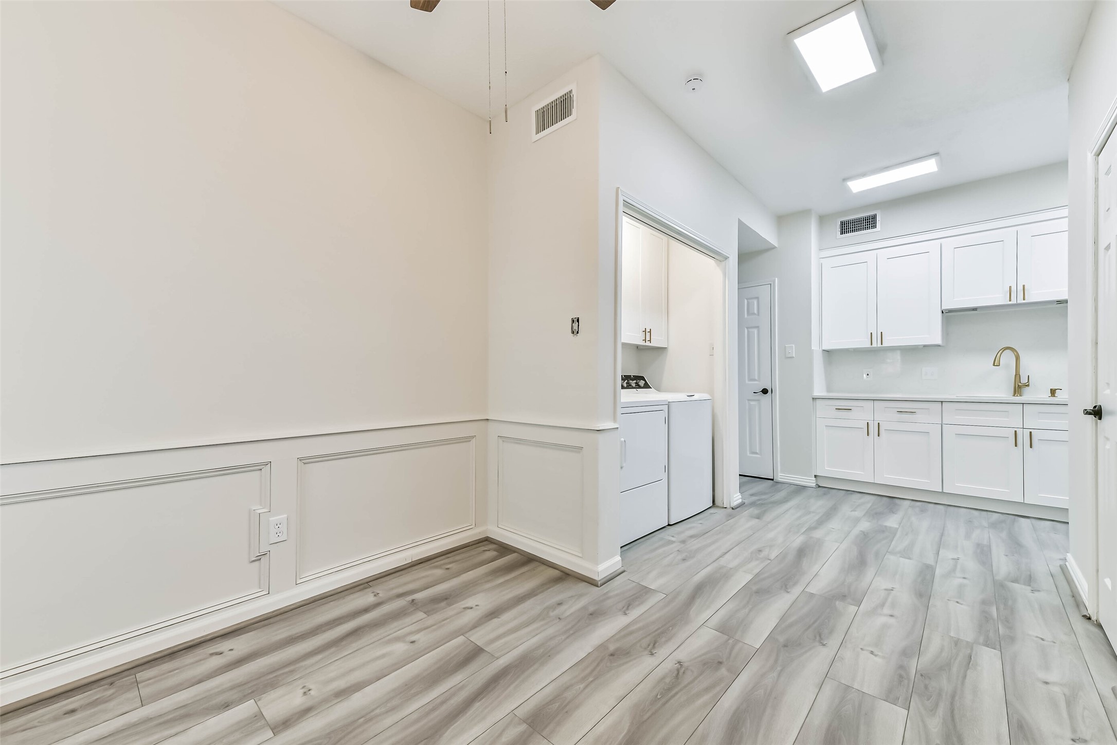 A different angle of the office/study looking towards the extended kitchen and utility closet.