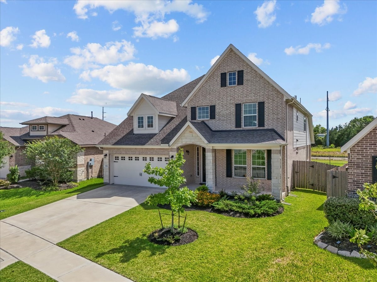 Stunning two-story home with brick and stone elevation with no back neighbors and water views