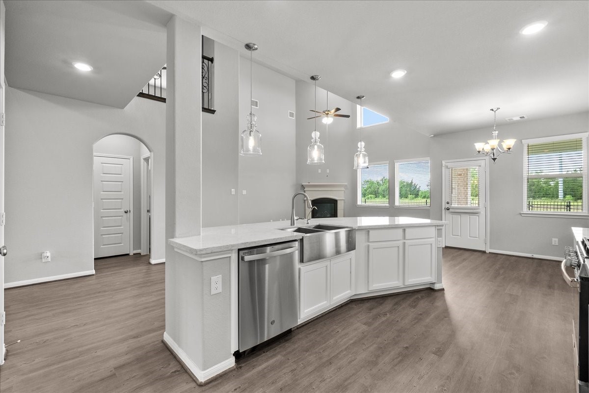 Chef's eat-in island kitchen features 42" cabinets with crown molding, stainless steel appliances and and designer backsplash