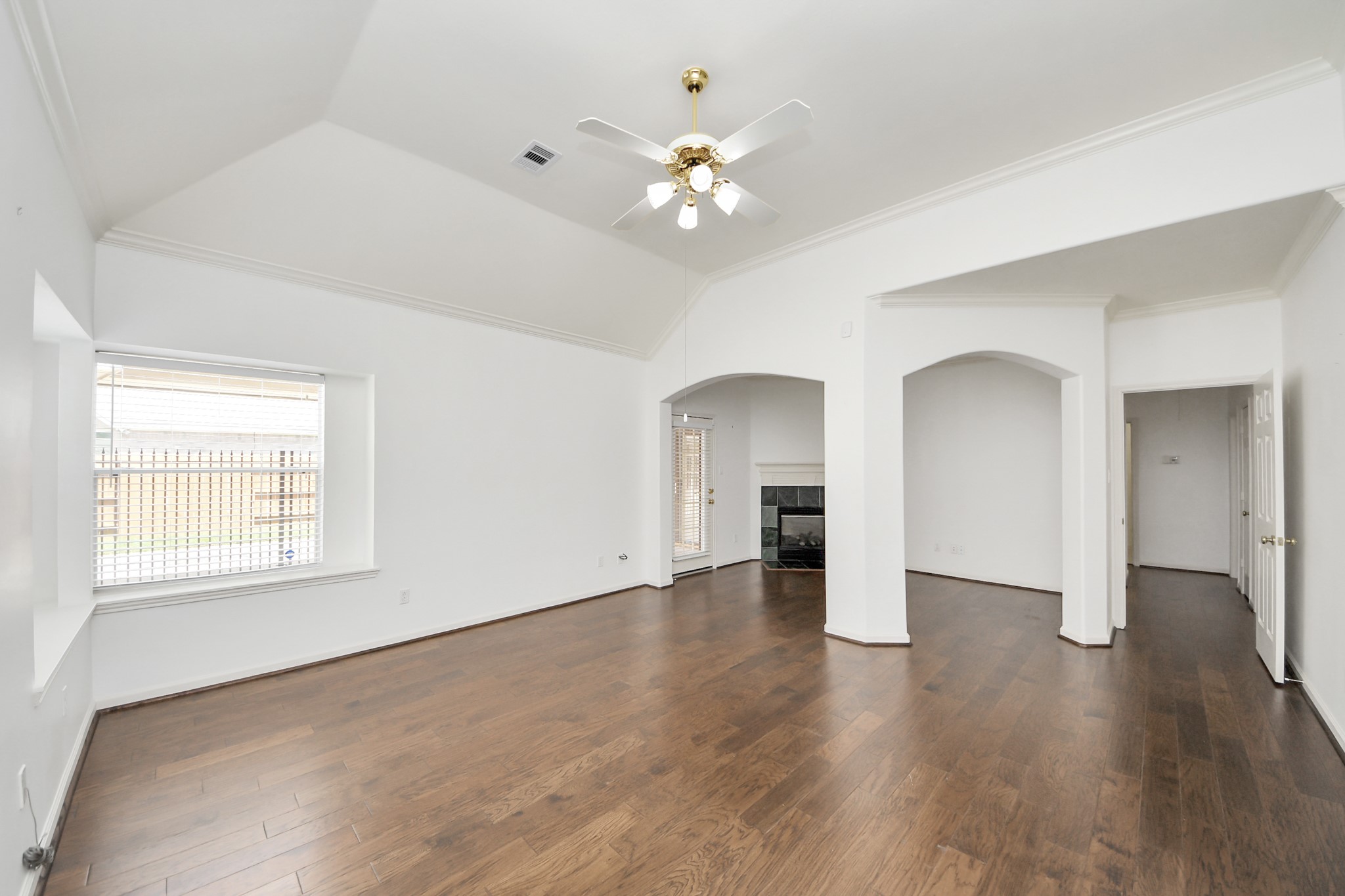 primary bedroom with separate sitting area and fireplace