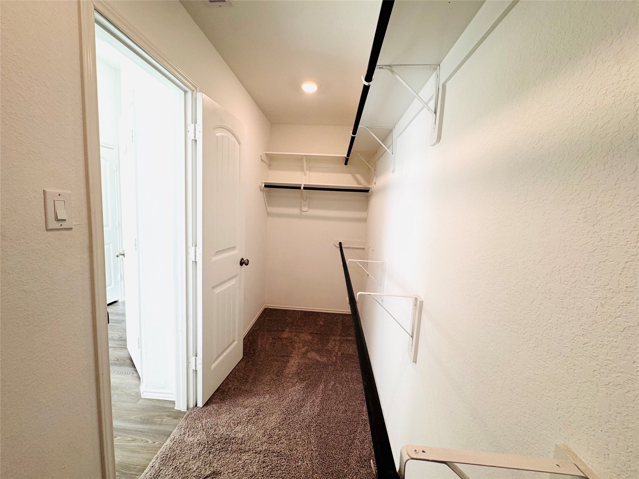Large walk-in closet in primary suite