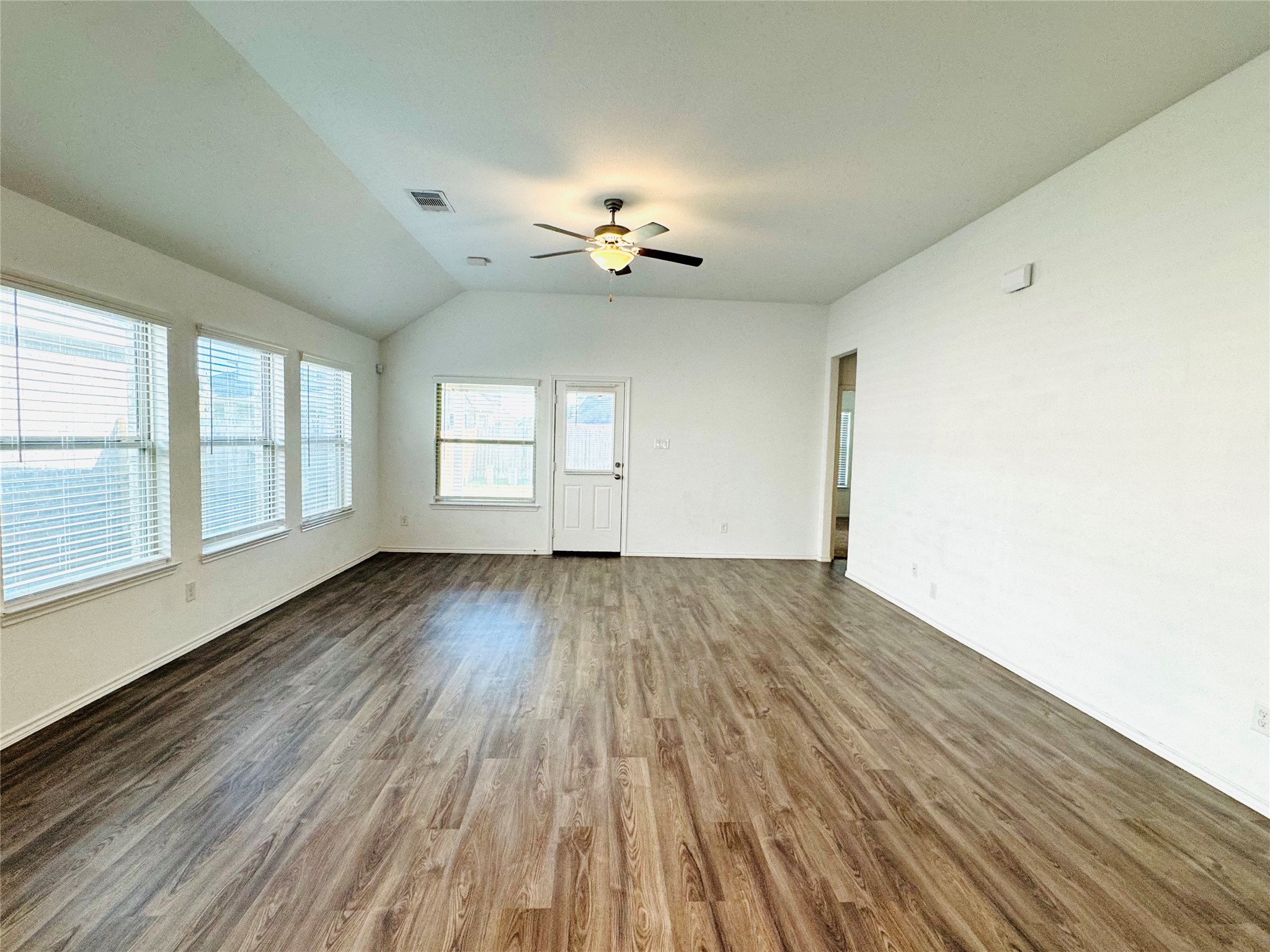 Living room with luxury vinyl and ceiling fan