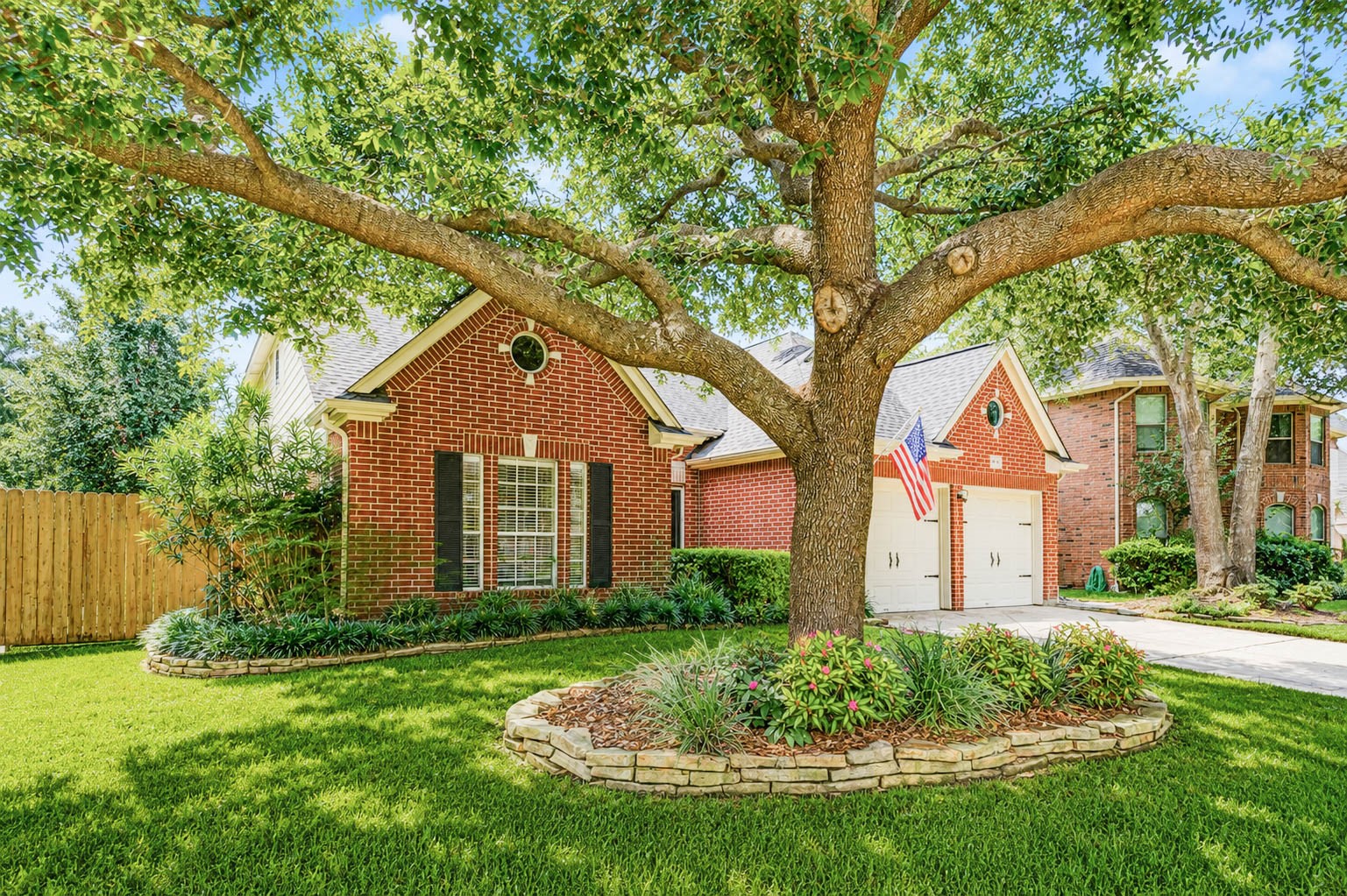 Beautifully manicured yard including a Japanese lace maple tree