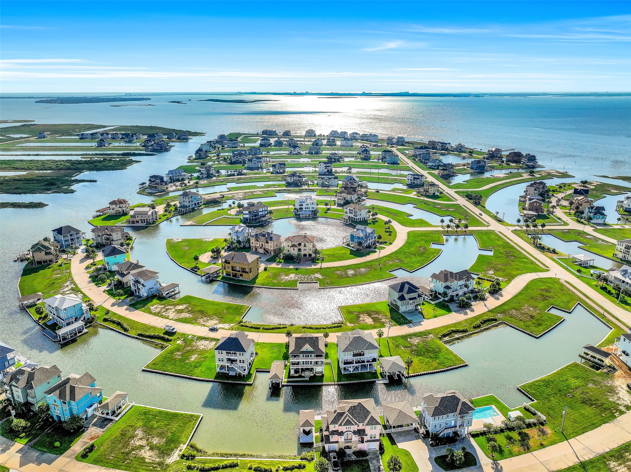 The aerial view tells you everything you need to know about Harborwalk. A stunning network of canals winds through the community, putting boaters just minutes from open water. 12 Fleming sits right on the canal with a private boathouse, 30-foot lift, and rebuilt dock  positioned perfectly for the water lifestyle this community was built around.