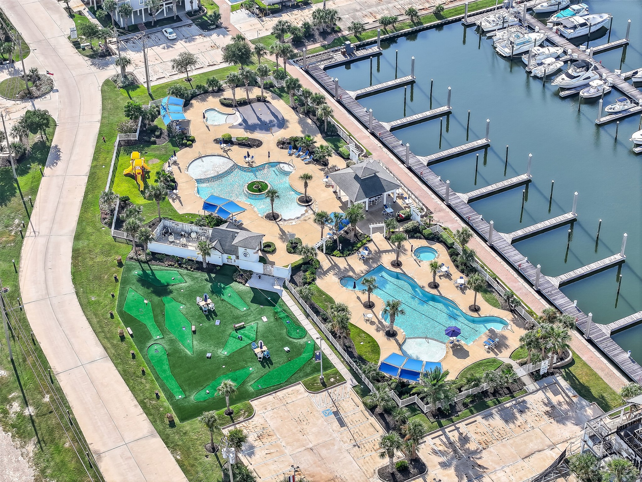 Nestled inside Harborwalk's Flamingo Isle  a gated, manned-entry waterfront community with a full-service marina, ship store, yacht club, hike and bike trails, and a community lodge. The lifestyle here starts before you even walk through the front door.