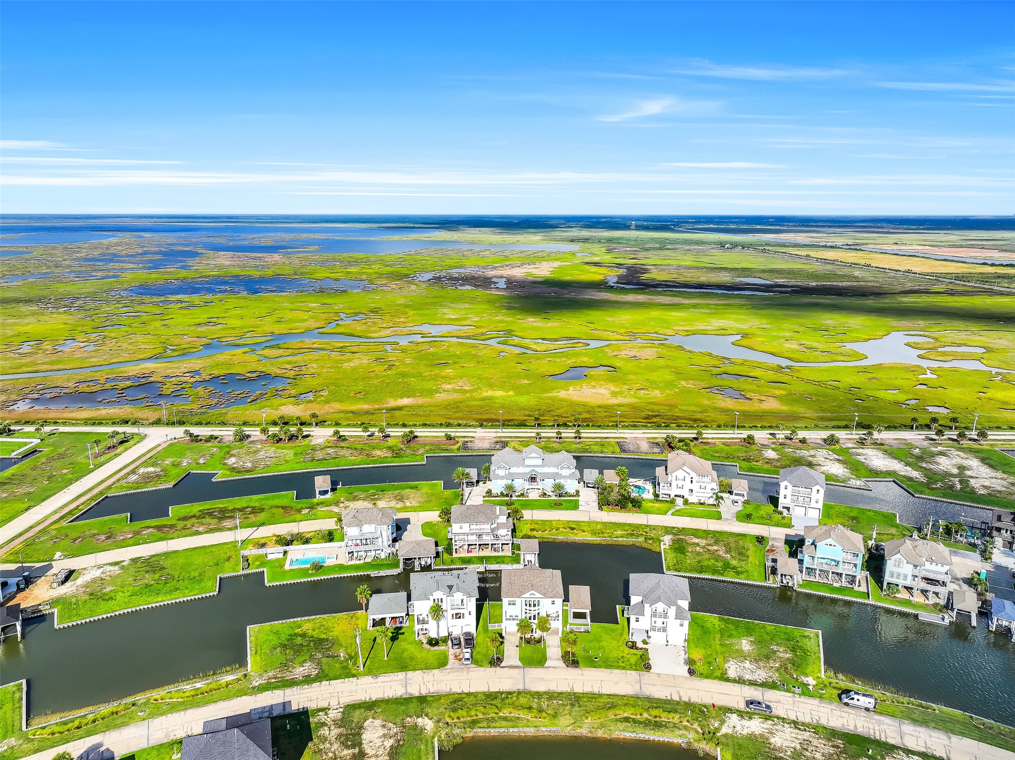 From above, the story of 12 Fleming becomes clear. Nestled inside Harborwalk's Flamingo Isle, this canal-front home sits at the edge of the water with direct access to the Intracoastal Waterway and Galveston Bay  surrounded by one of the most beautifully planned waterfront communities on the Texas Gulf Coast.