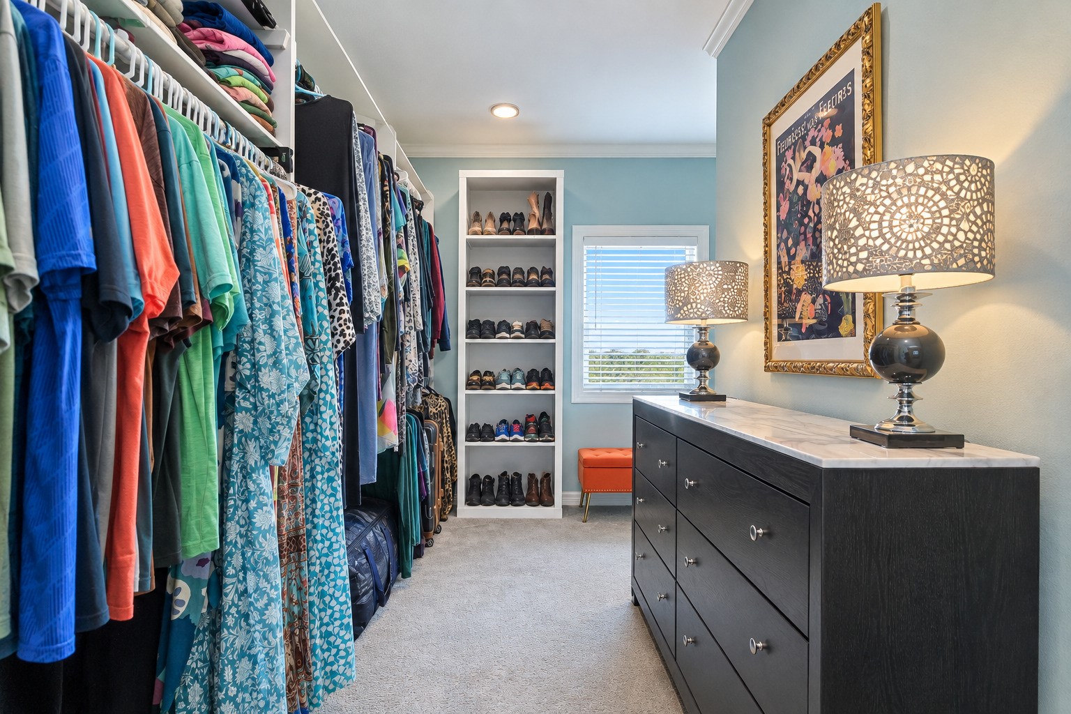 This is not a closet  it is a dressing room. The primary suite walk-in closet features custom built-in shelving, dedicated drawer space, and enough room to organize everything with ease. Built as part of the full 2025 luxury rebuild, every inch was designed to be as functional as it is beautiful. The details in here are the kind you notice every single morning.