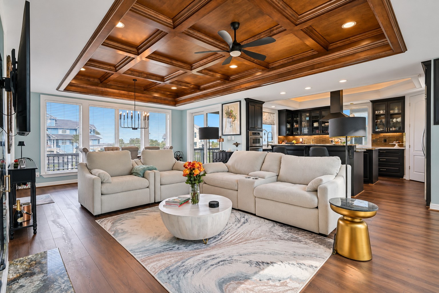 That ceiling is not a detail  it is a statement. The coffered judges ceiling in the living room was built entirely on-site by a master woodworker, with stained threshold and rail tops that flow seamlessly into the flooring below. You will not find this level of craftsmanship in a standard remodel.