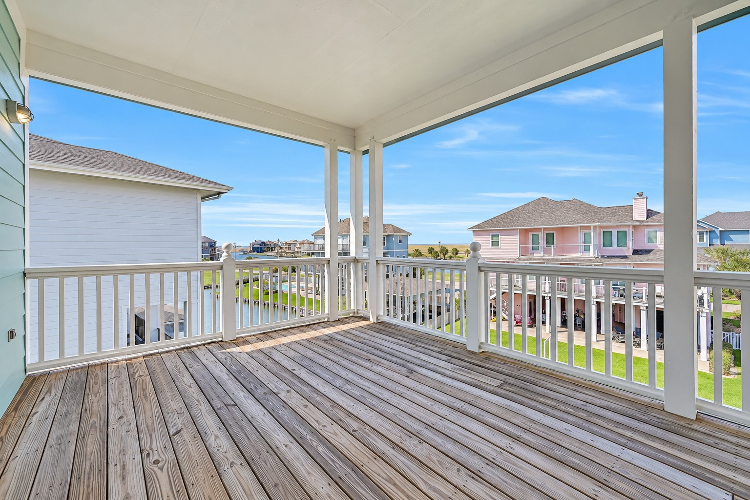 Five connecting balconies wrap this home at every level, creating an outdoor living experience that flows as naturally as the interior. Step outside from the living room, the dining area, the primary suite, or any guest room and you are immediately on the water  with nothing between you and the canal but open Gulf Coast air.