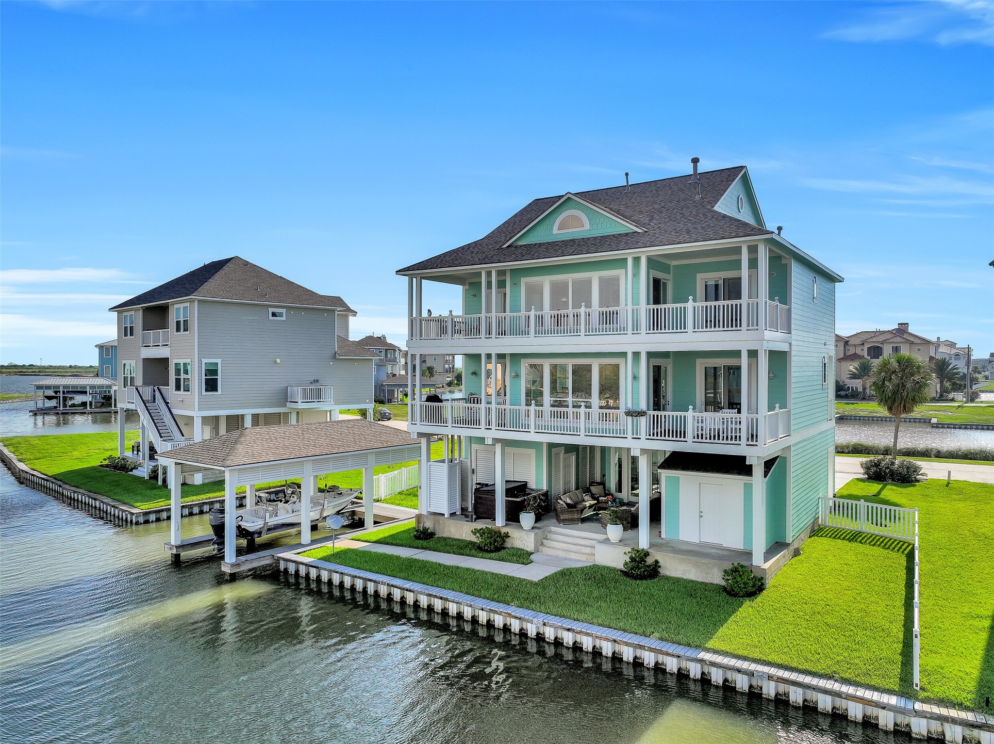Your boat lives here. Private boathouse with a 30-foot electric lift, fully rebuilt dock with treated lumber and stainless steel hardware, and direct canal access to the Intracoastal Waterway  this is what Harborwalk living is all about.