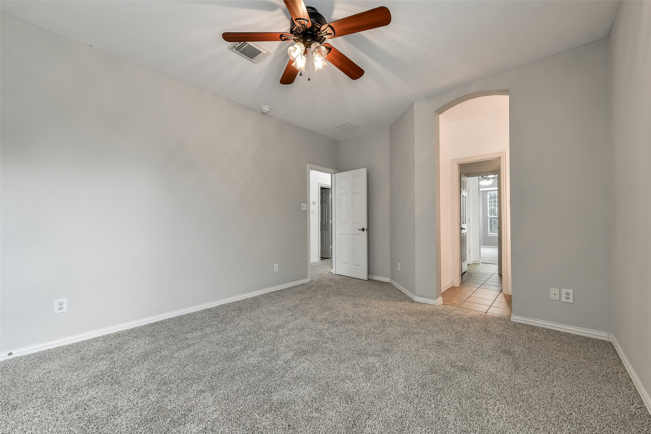 One of three additional second floor bedrooms. Opens to full Jack & Jill bathroom.