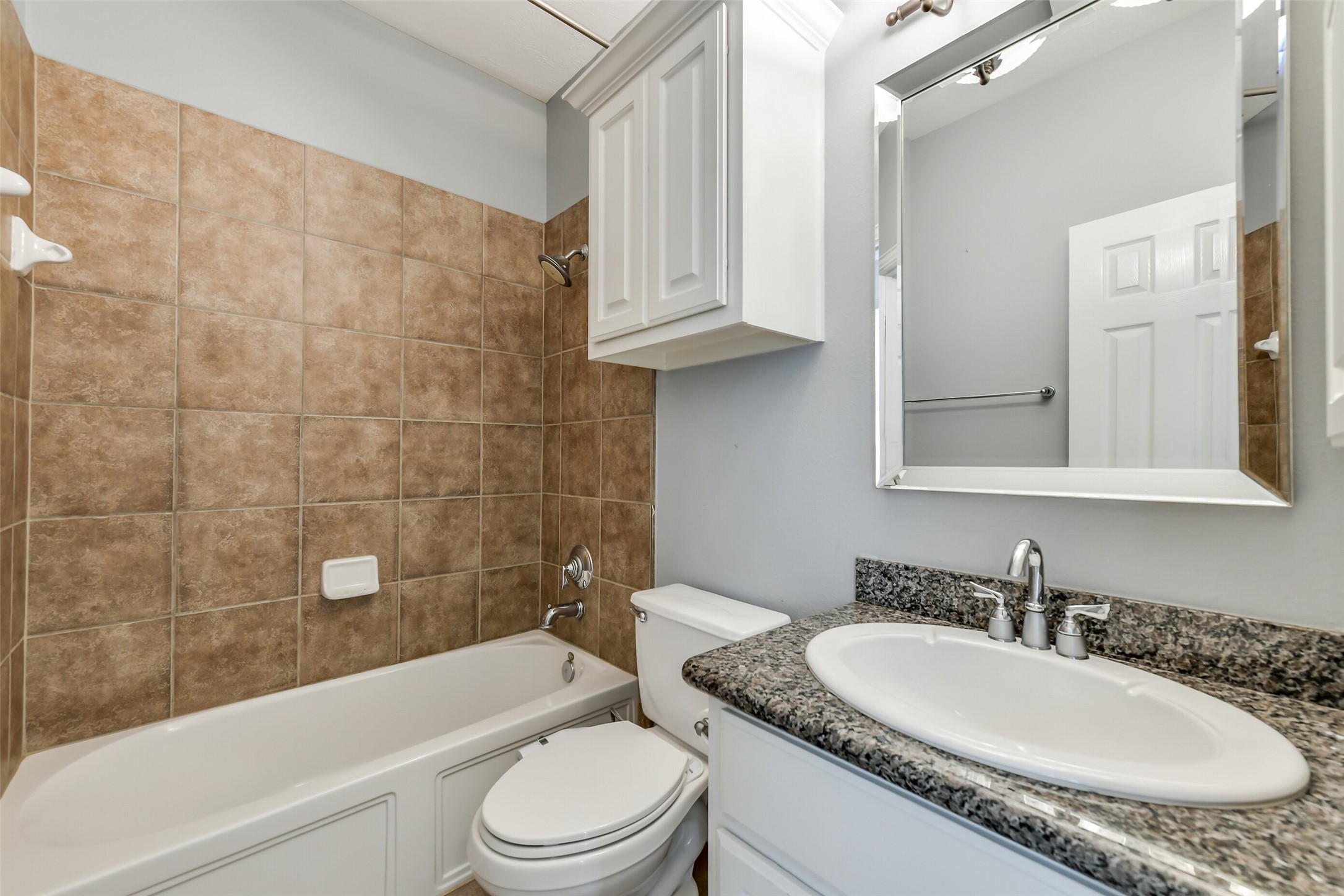 Full bath on main level serving the secondary bedroom.