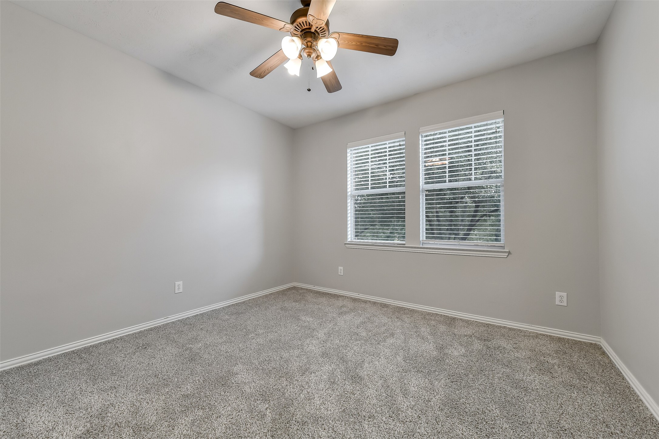 A spacious fifth bedroom on the second floor, perfect for guests, family, or a secondary home office