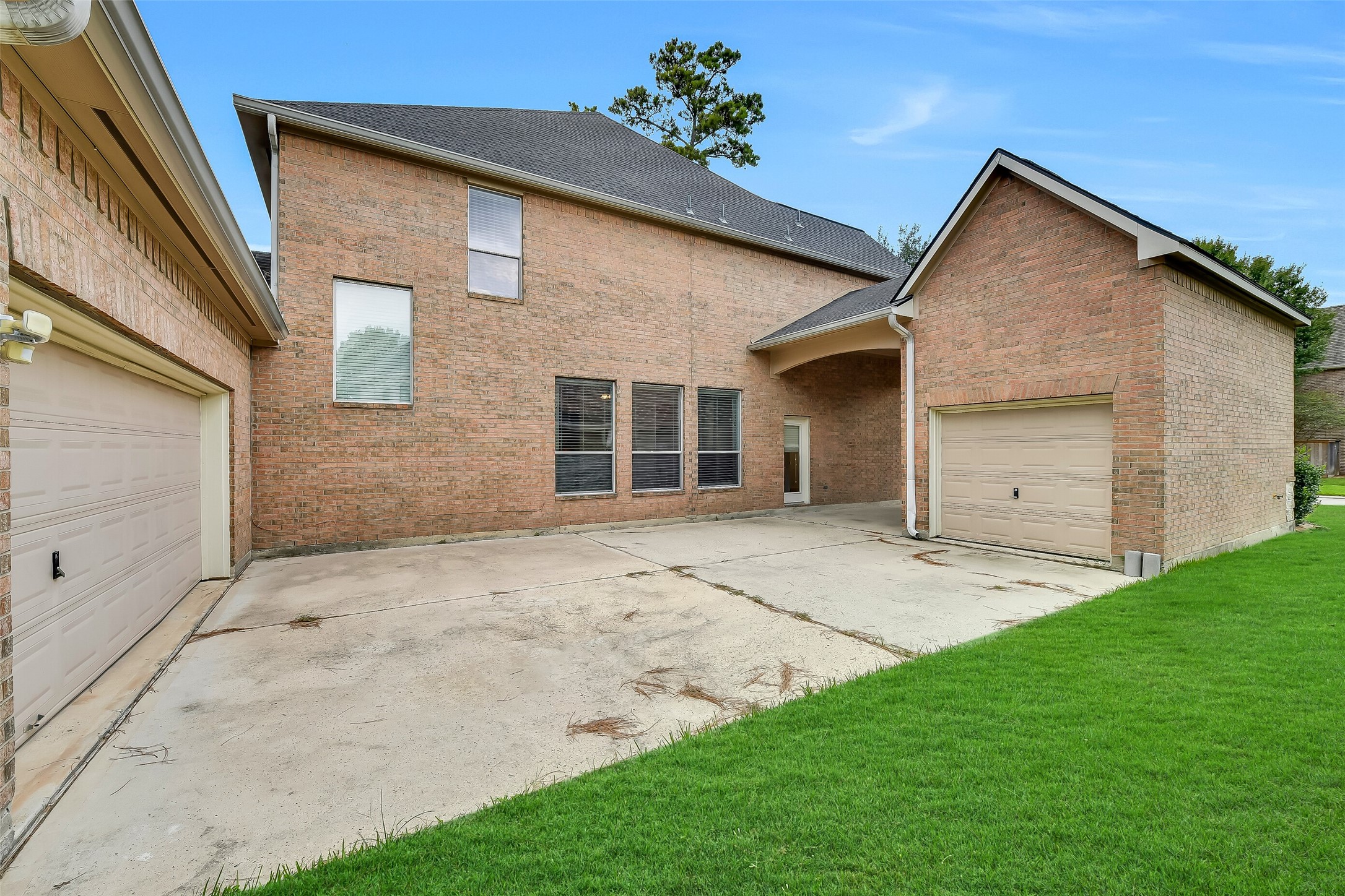 A generous paved area between the two garages provides ample parking for additional vehicles or a versatile outdoor venue perfect for crawfish boils and entertaining. Fully fenceable and easily gated for complete privacy