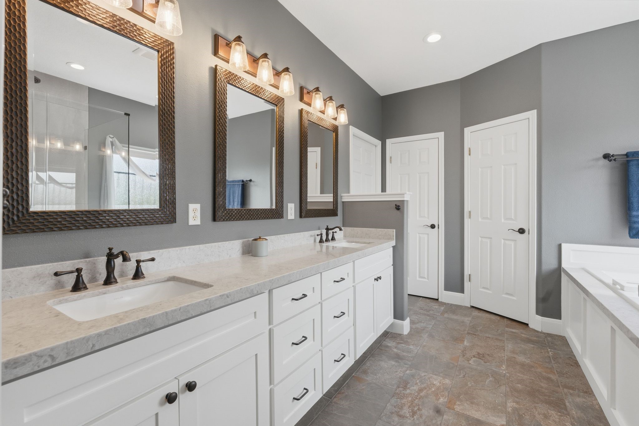 Dual Sinks, Tile Flooring, Linen Closet.
