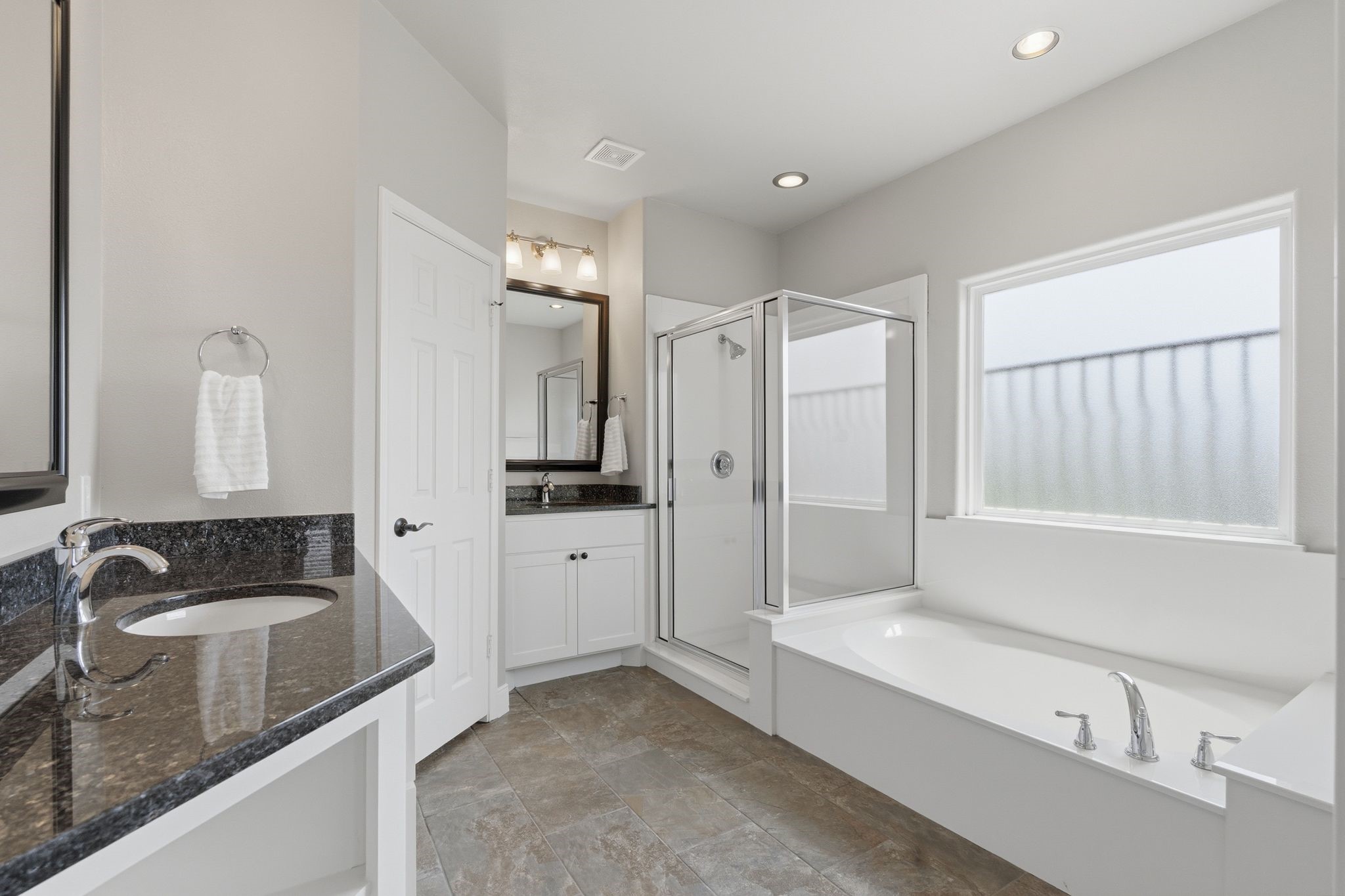 Full Bath Off Media Room would easily make  another Primary Bedroom.