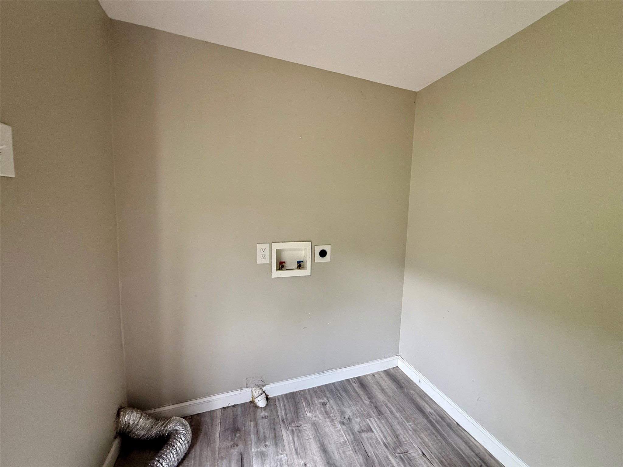 The carport door entrance leads you right into the utility/mud room inside the house