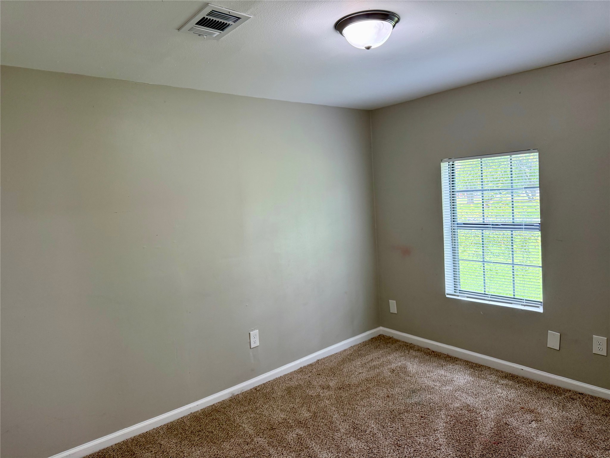 Bedroom perfect for an office, play room, or flex room