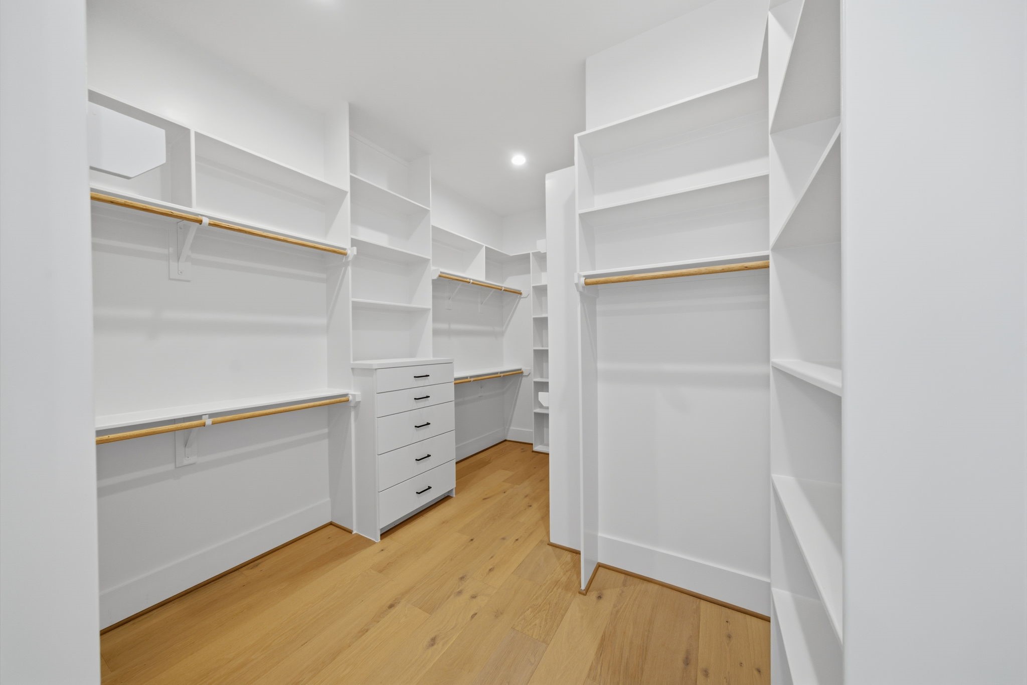 HUGE walk-in closet with built-ins and plenty of space to keep organized. This is one of two master closets. (Photos are of a previously completed home. Finishes are subject to change.)