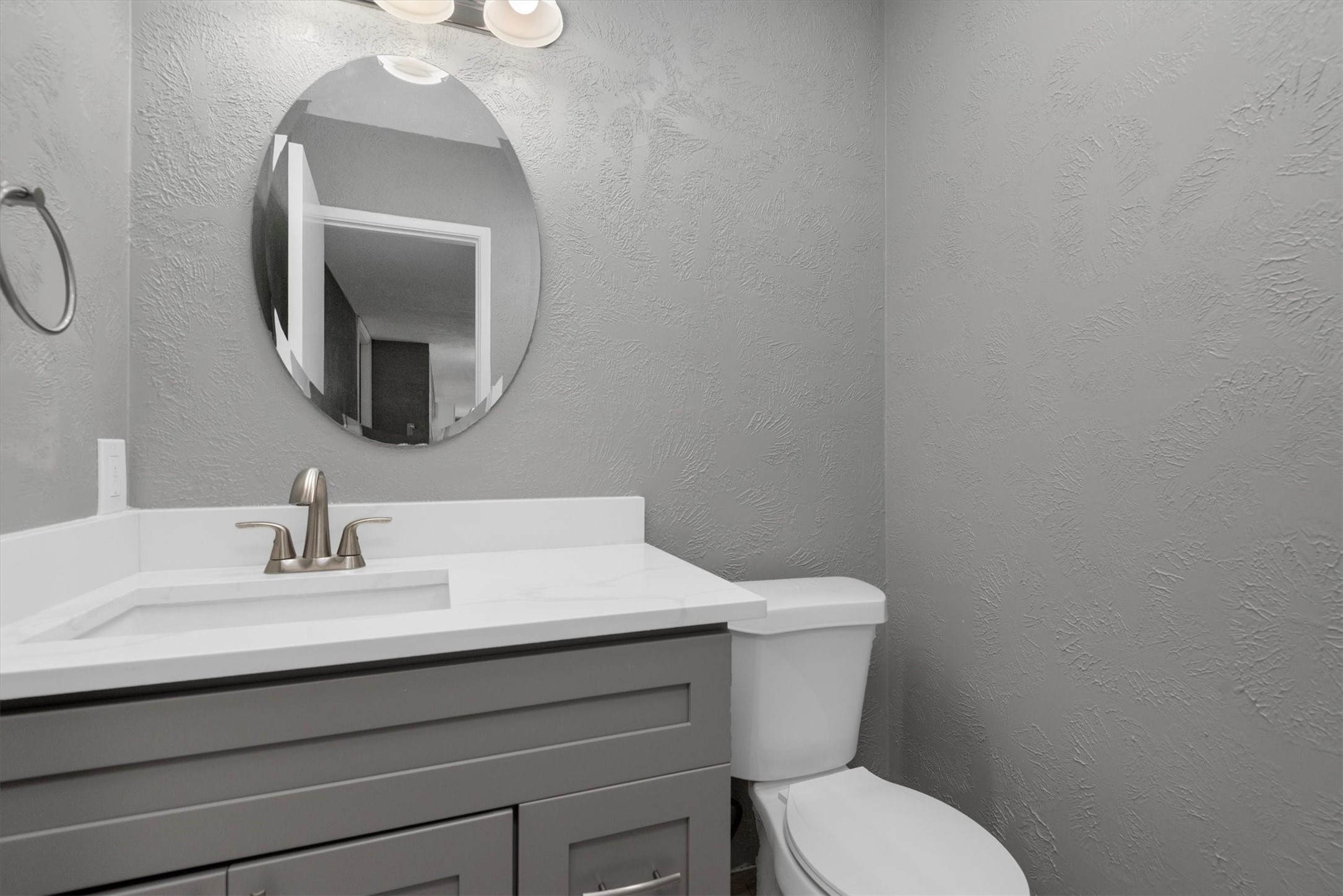 There is a new mirror in 1/2 Bath