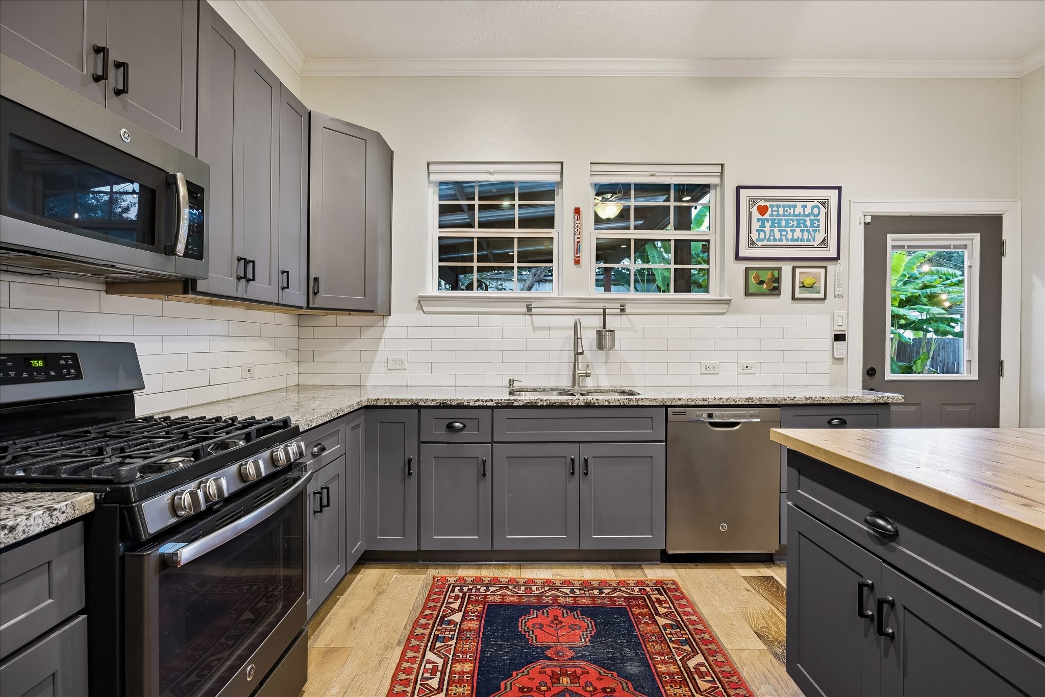 Look out to your backyard oasis from the kitchen sink windows