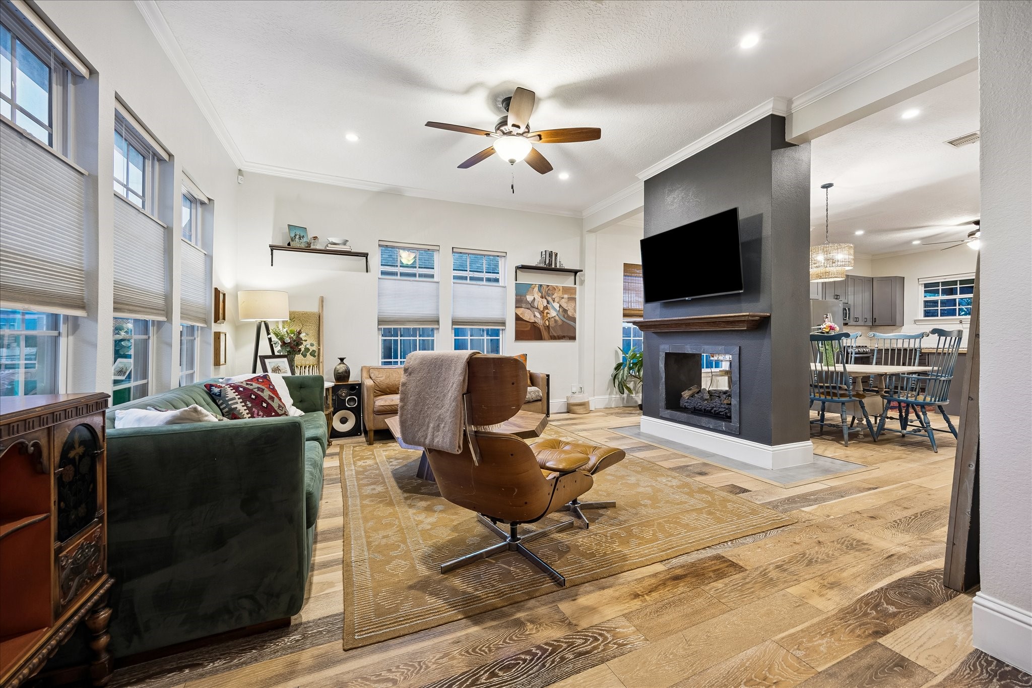 Stunning open concept living room with a double sided fireplace as a focal point