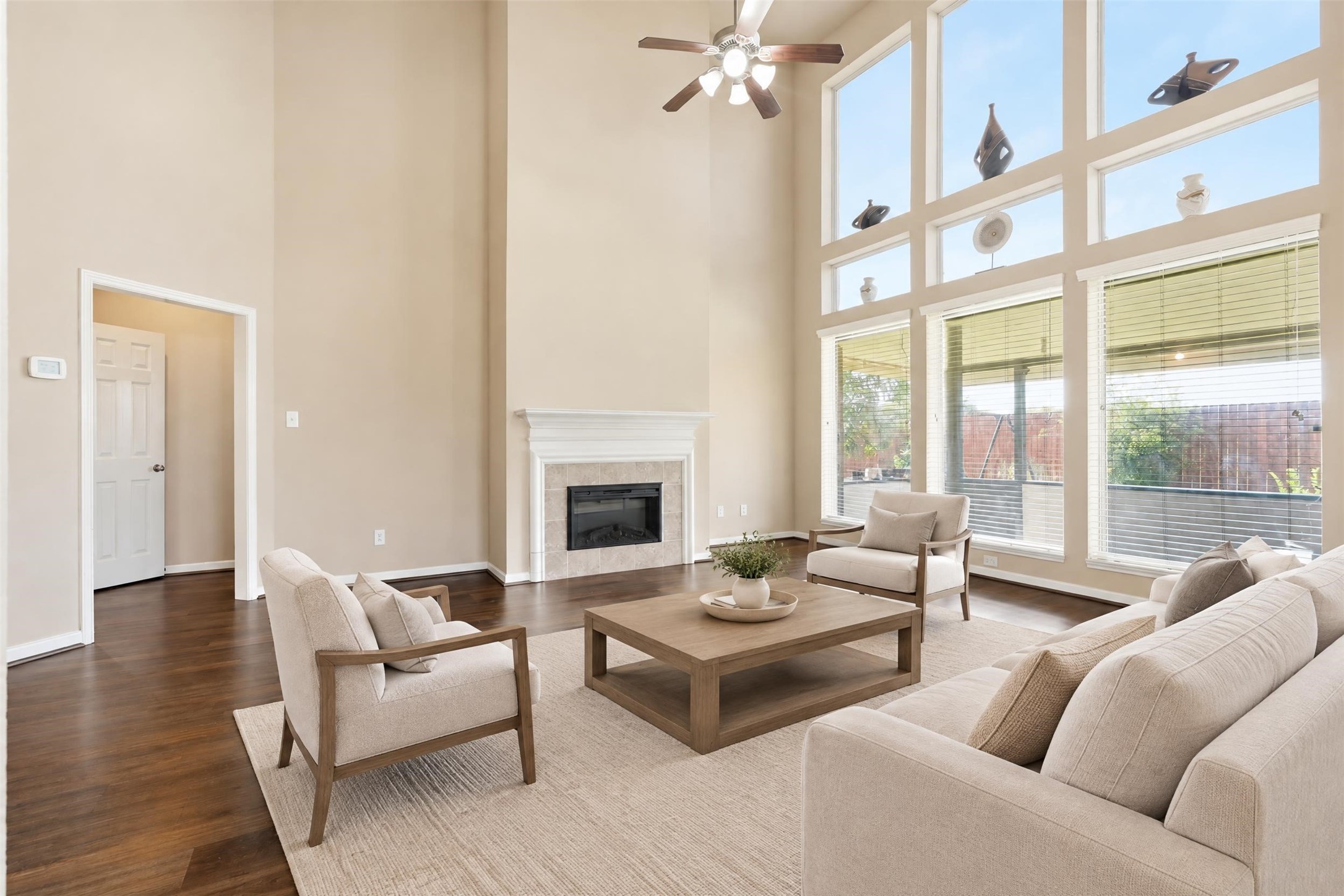 Virtually staged. Easy-care updated flooring and an electric fireplace make this a comfortable everyday gathering spot that also works for entertaining.