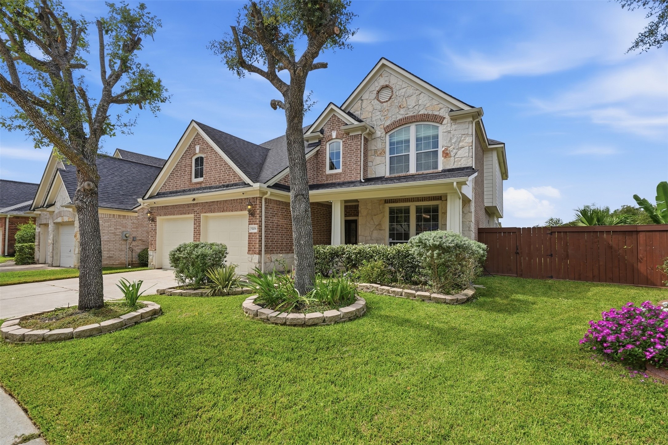 Mature shade trees, stone-edged flower beds and sprinklers front and back keep the curb appeal easy to maintain. A cul-de-sac lot means less through traffic and a quieter street.