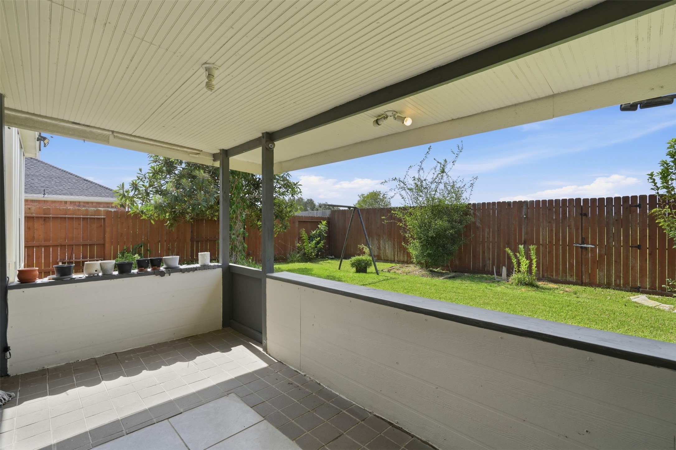 Covered patio, ideal for Houston evenings. Grill out, enjoy the breeze and keep an eye on the yard from the shade.