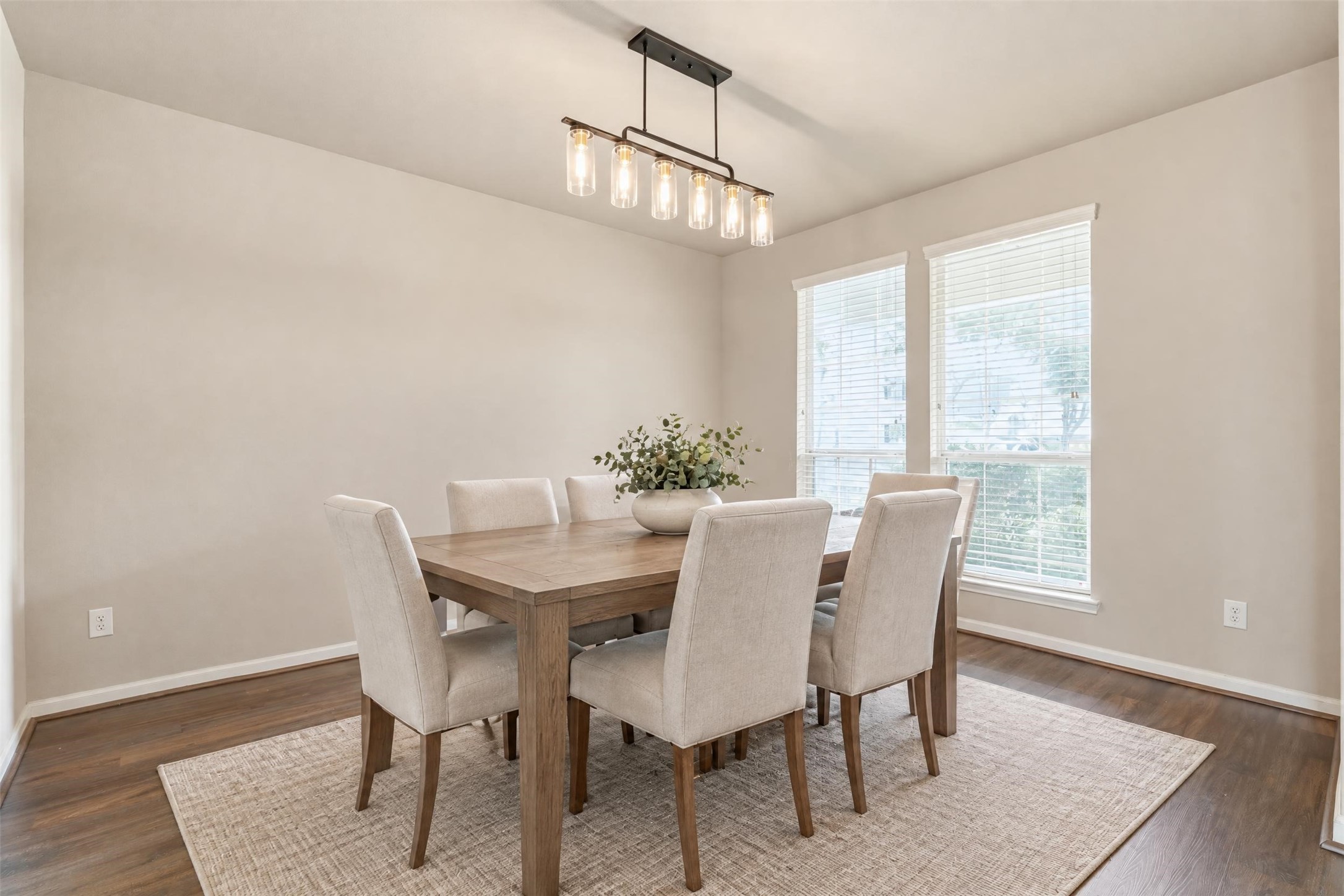 Virtually staged. A light-filled formal dining room right off the entry, sized for holiday dinners and Sunday get-togethers, with easy access to the kitchen.