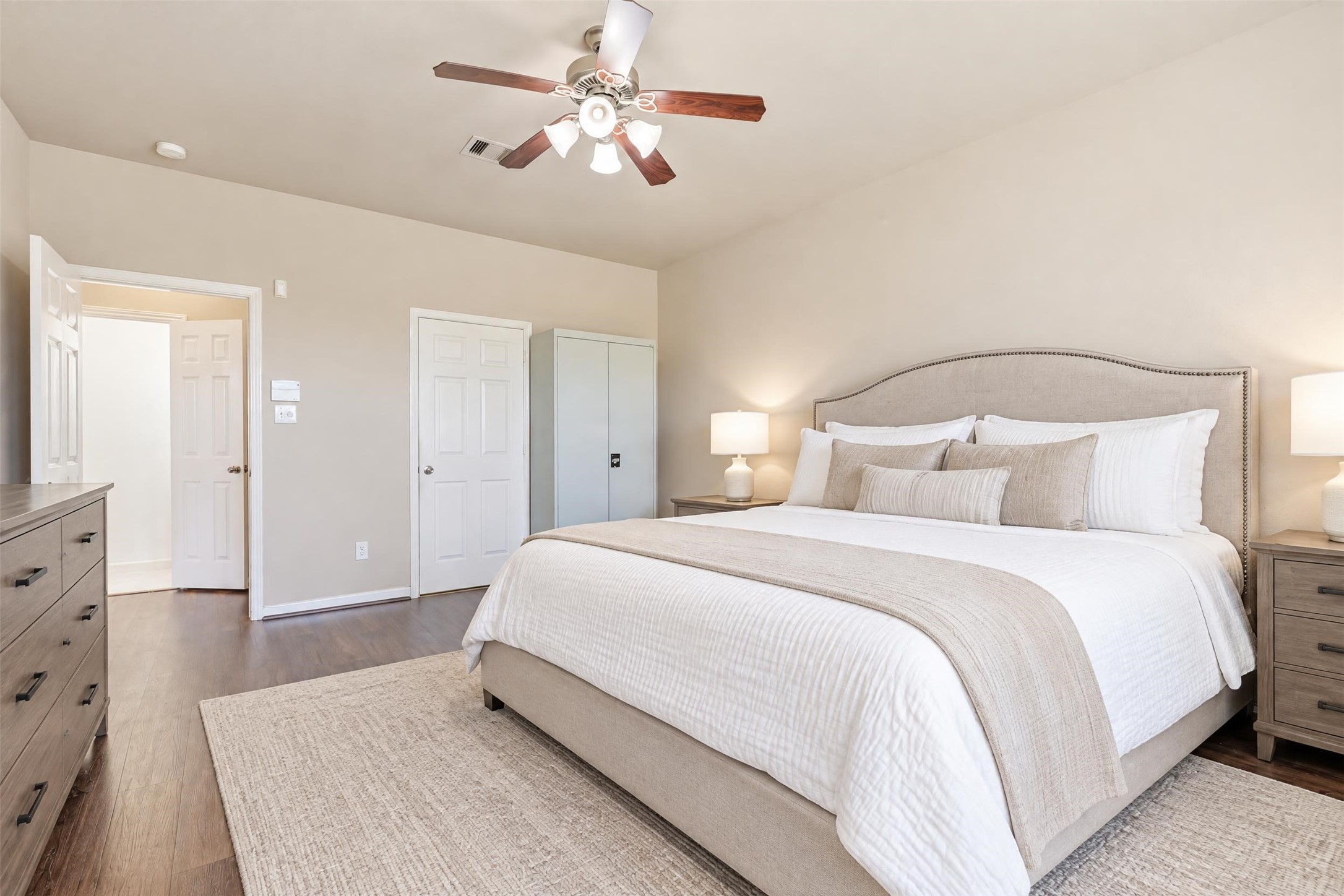 Virtually staged. Large windows bring in soft natural light, and the main-level location means no stairs at the end of a long day.
