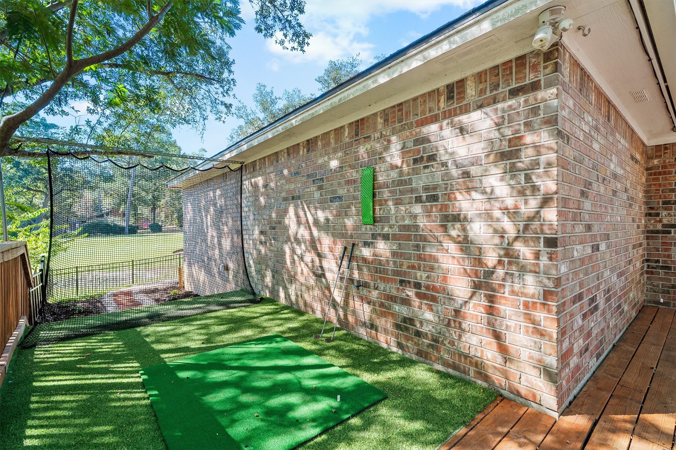 Heres the golfers bonus: a netted practice area with turf and a hitting mat, so you can work on your swing before ever heading to the first tee.