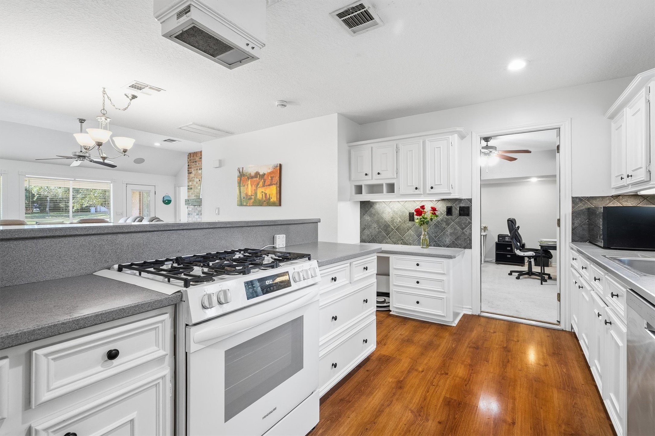 Just off the kitchen, part of the original garage has been converted into a flex room, ready for a home office. hobby space, or 3rd bedroom. The rest of the garage stays put as a golf cart garage, so your ride to the course still has a home.